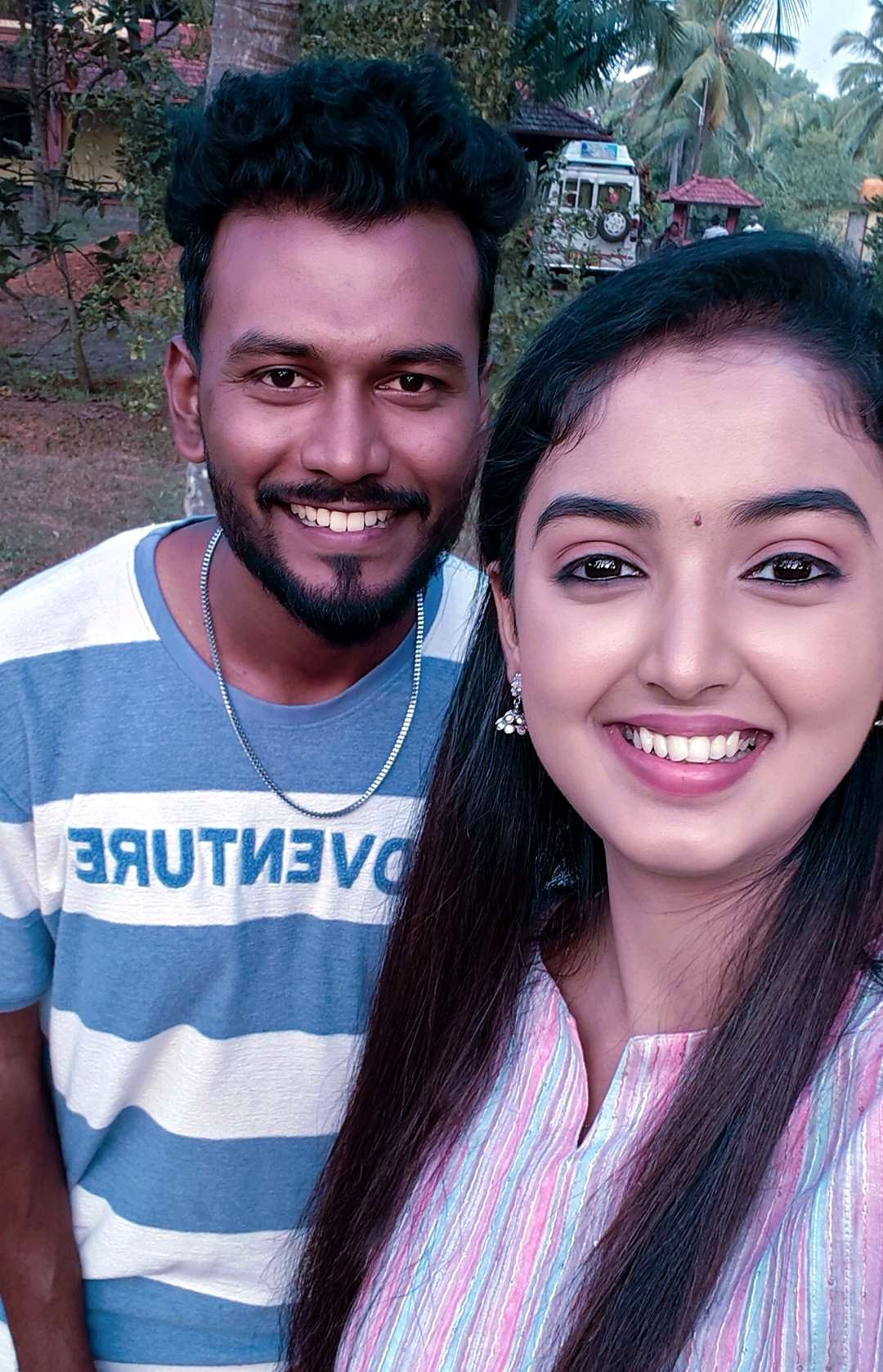 Aarav on location with a client wearing a fresh, natural daytime makeup look